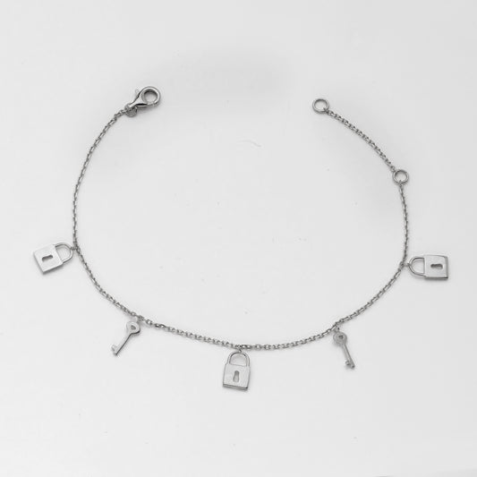 14KW 0.30CTW DIAMOND LOCK AND KEY CHARM BRACELET